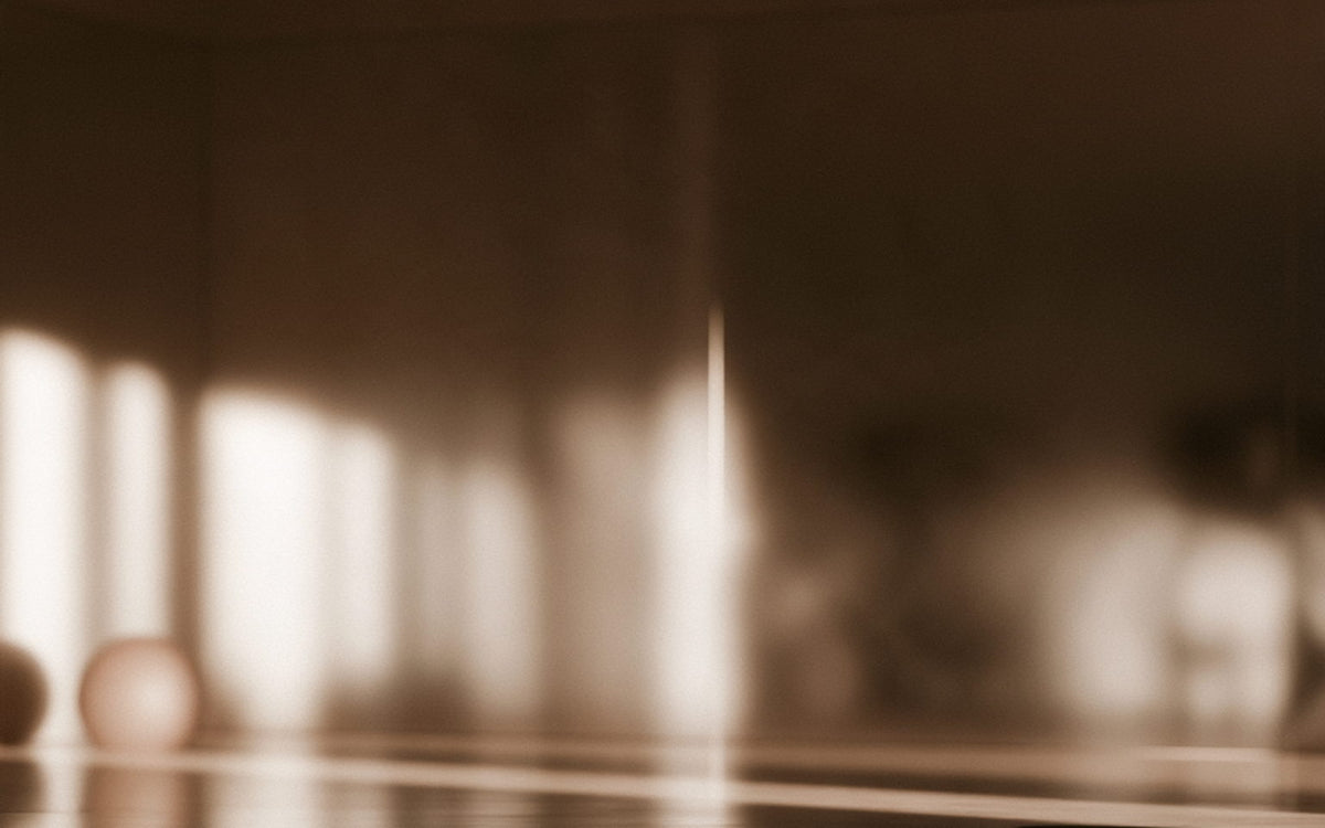 A clean, bright gym floor in warm morning light